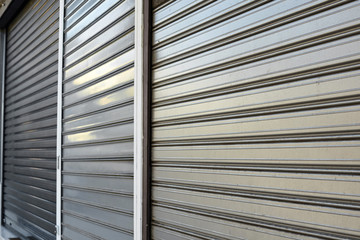 Metal gate protecting a store. Close shop.