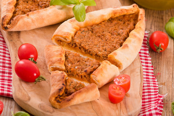 Turkish pide pizza with meat and onion. 