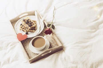 Obraz na płótnie Canvas Tray with waffles and coffee