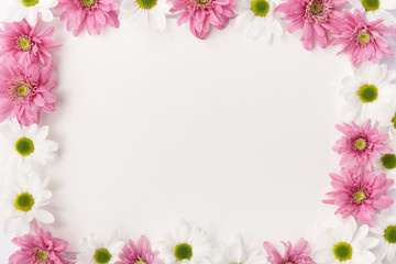 Frame made of white and pink flowers