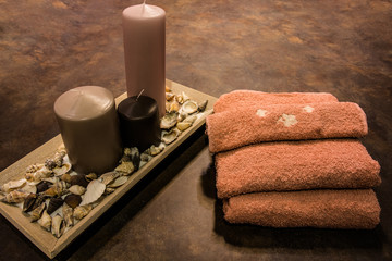 Obraz na płótnie Canvas Candles and towels concept of spa and relaxation