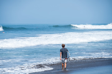 Surfing the waves of Indonesia beach