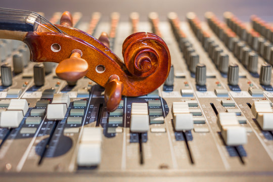 classical violin headstock on sound mixer, music background