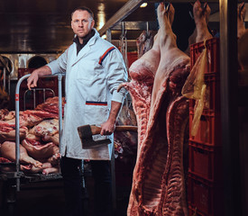 Fototapeta na wymiar A butcher in a meat factory.