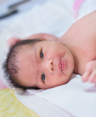 newborn baby girl feeling fresh after take a bath, selective focus, soft focus, newborn baby concept