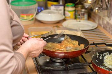 Frying the fish - carp, at home in the oil pan.