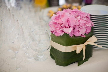 Elegant flower decoration on the table in restaurant for an event party or wedding table