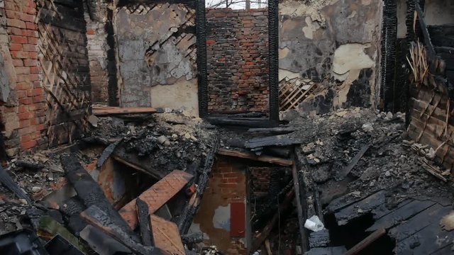 interior old burnt of burned-down fire wooden house after