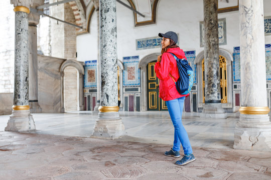 happy young tourist woman visit ancient Istanbul Topkapi palace