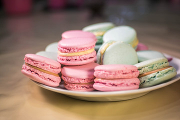 French macarons - meringue cookies with ganache or buttercream filling. Colorful macaroons, horizontal view