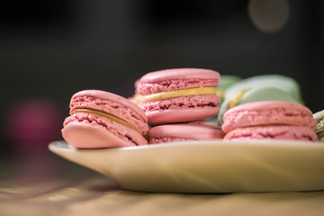 French macarons - meringue cookies with ganache or buttercream filling. Colorful macaroons, horizontal view