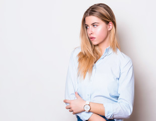 beautiful young woman in casual outfit wearing wrist watch