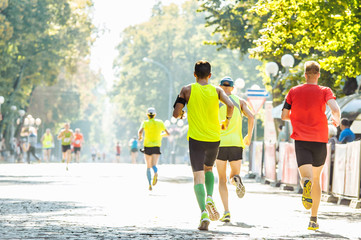  Athletes run in the park on the running marathon - obrazy, fototapety, plakaty