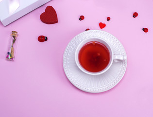 Obraz na płótnie Canvas tea with berries of viburnum
