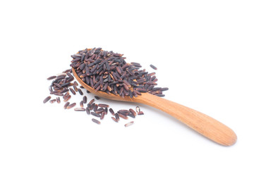 Riceberry in wooden spoon isolated on white background. Riceberry is the new variety of rice that has been bred in Thailand. The rice is deep purple in colour is rich in many antioxidant