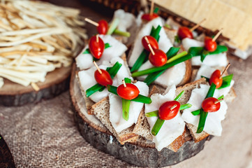 Hearty lard with garlic served with fresh bread on a table.