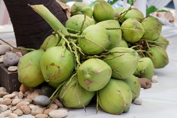 Bunches of fresh coconut lay on the floor