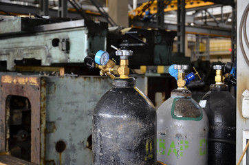 Professional machinist. Horizontal shot of a man operating lathe grinding machine metalworking industry concept copyspace.  Cropped shot of a industry worker at his workshop