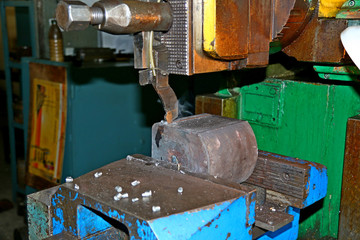 The CNC milling machine cutting the sample part with the flat endmill in light blue scene.The rough endmill cutter for CNC machine with lighting effect