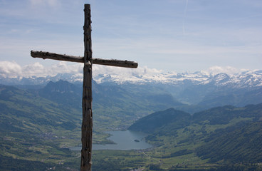 Swiss Alps scenery with wooden cross