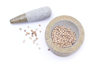 white  peppercorns in stone mortar isolated on white background
