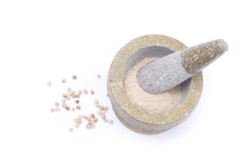 white  peppercorns powder in stone mortar isolated on white background