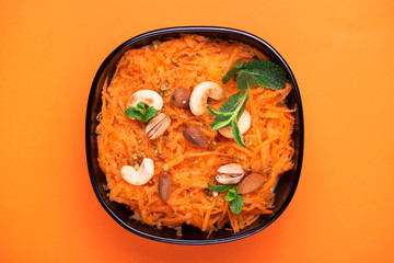 Indian carrot Gajar halwa. Copyspace, top view, flatlay. Color surge