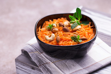 Indian carrot Gajar halwa. Copyspace, horizontal view, flatlay.