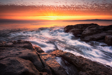 Dawn above the rocks /
Sea sunrise at the rocky Black Sea coast near Sozopol, Bulgaria