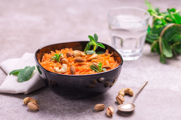 Indian carrot Gajar halwa. Copyspace, horizontal view, flatlay.