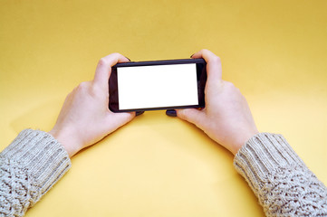 woman hand holding the phone with isolated screen