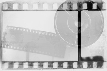 Vintage black and white film strip frame with faded rolled film.