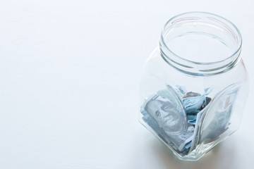 glass jar for donations with place for text on a white background