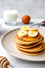 cooked pancake on plate at wooden background