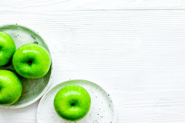 green apples for healthy dessert on white background top view mo