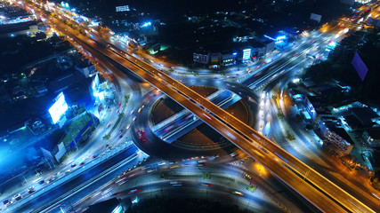 Aerial view, Road roundabout, Expressway with car lots in the city in Thailand.  beautiful Street , downtown, cityscape, Top view. Background