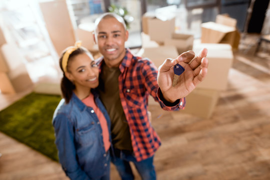 Selective Focus Of African American Couple Hugging And Holding Keys From New Home