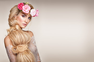 Beautiful woman portrait with long blonde hair and flowers on head. Tender bride. - 188693503