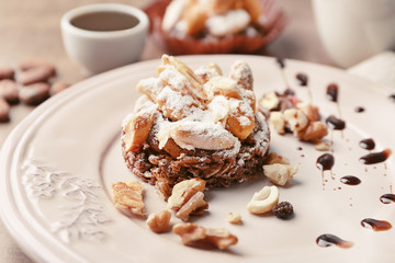 Plate with tasty praline cake, closeup