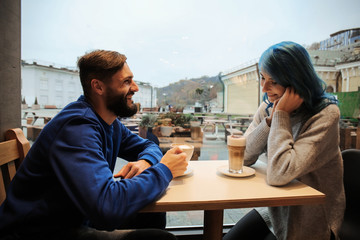 Young hipster couple in cafe