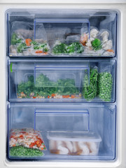 Different vegetables in refrigerator freezer