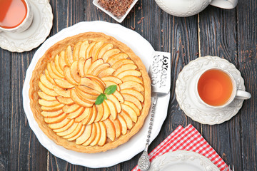 Homemade apple tart on wooden table