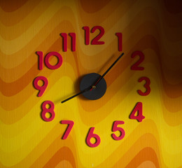 large wall clock with colorful numbers