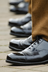 Soldiers in uniform with highly polished shoes
