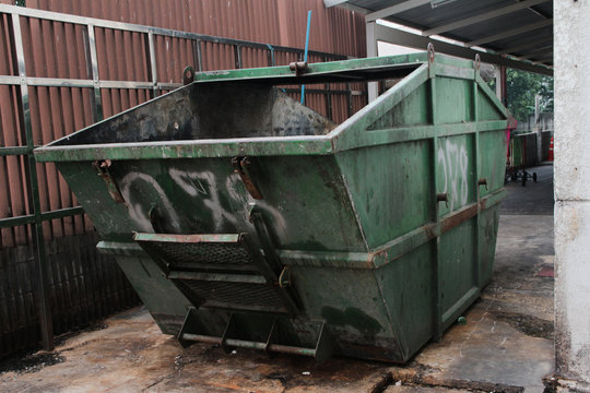 green garbage truck
