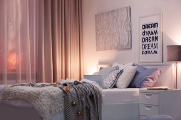 Modern room interior with comfortable bed