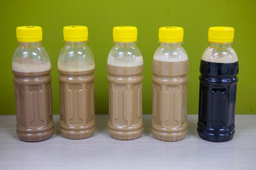 Ice coffe latte and black coffee in bottles