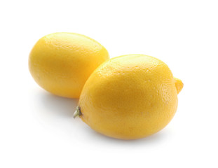 Fresh ripe lemons on white background