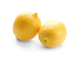 Fresh ripe lemons on white background