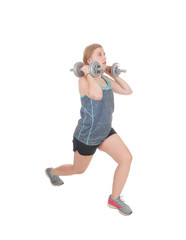 Fototapeta na wymiar Young woman lifting her two dumbbell's